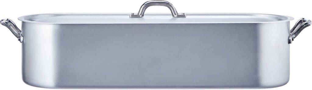 Cuisiner un grand poisson entier — qu'il s'agisse d'une truite saumonée, d'un bar de ligne ou d'une belle daurade — est toujours la promesse d'un repas de fête spectaculaire et convivial. Cependant, la cuisson du poisson présente un défi de taille : sa chair, extrêmement délicate, a tendance à s'attacher au fond ou à se briser en morceaux lors du service.